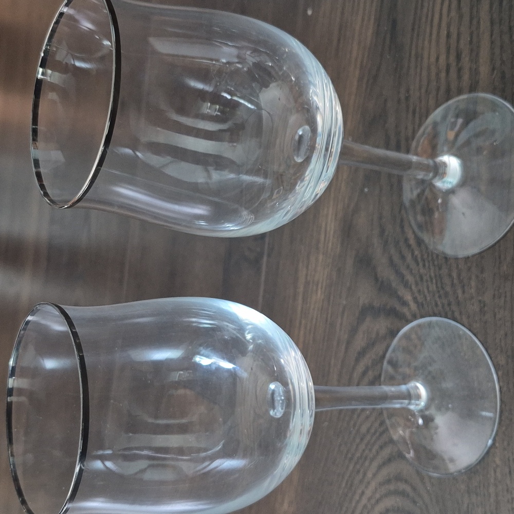 Pair of crystal wine glasses with platinum silver rim. Nice condition.